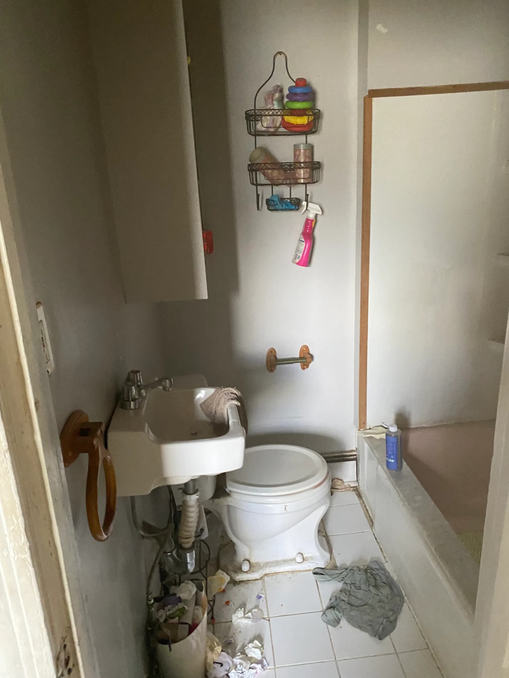 A bathroom being cleared and prepared as a property changes hands.